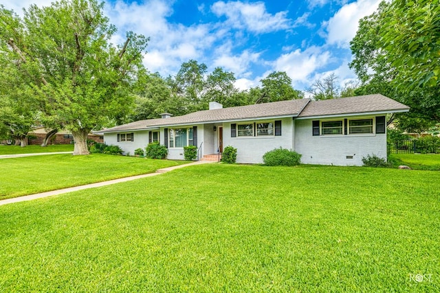 ranch-style home with a front yard