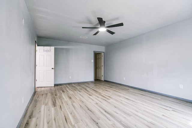 512 Ave J, Ozona, TX 76943 - spare room featuring a ceiling fan, wood finished floors, and baseboards