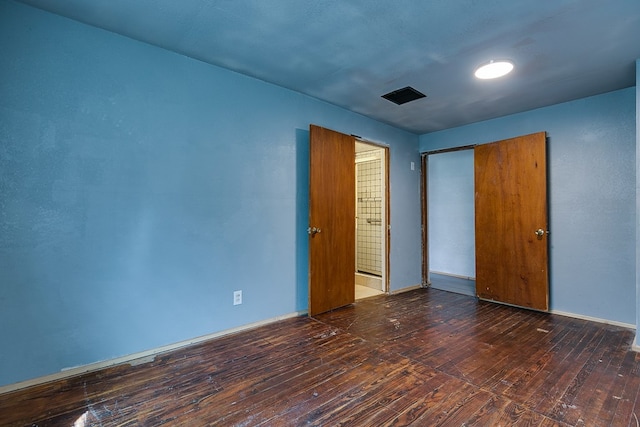 512 Ave J, Ozona, TX 76943 - unfurnished bedroom with hardwood / wood-style flooring and a closet