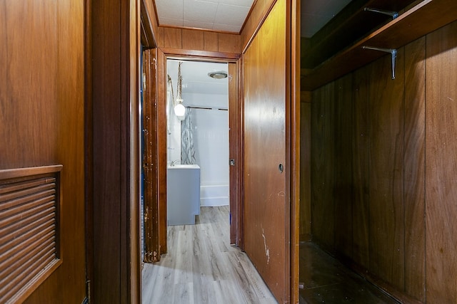 512 Ave J, Ozona, TX 76943 - hallway featuring wooden walls and wood finished floors