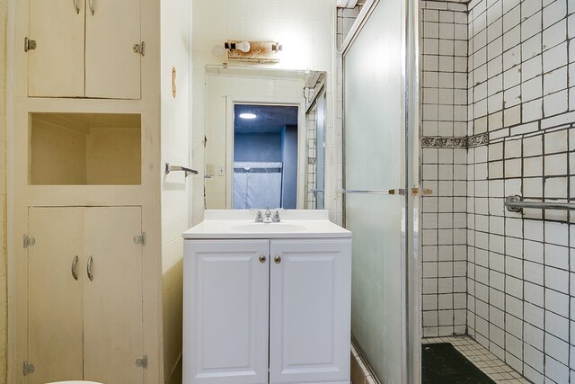 512 Ave J, Ozona, TX 76943 - full bathroom featuring vanity and a shower stall