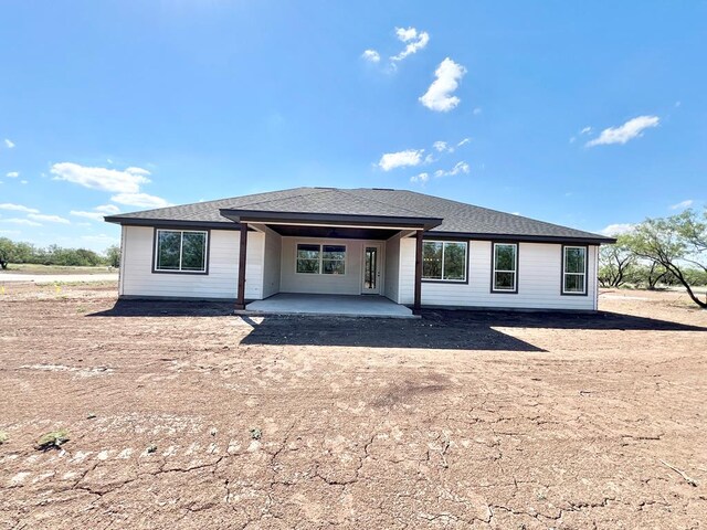 rear view of house with a patio