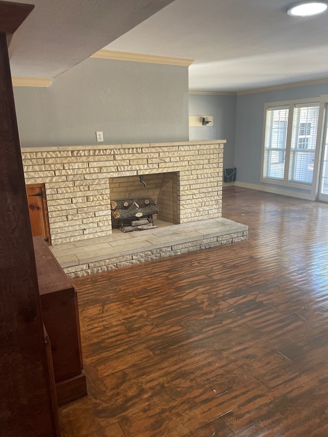 unfurnished living room featuring crown molding and dark hardwood / wood-style floors