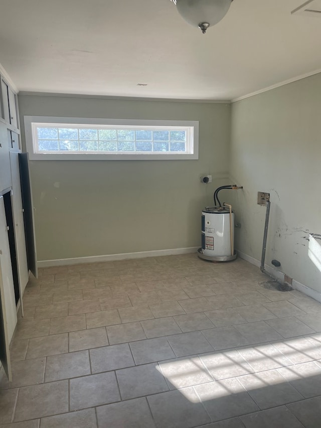 washroom featuring plenty of natural light, ornamental molding, and water heater