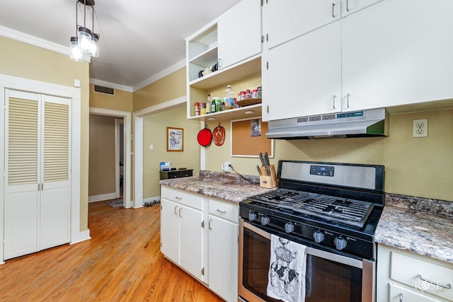 kitchen featuring white cabinets, crown molding, pendant lighting, and stainless steel gas range