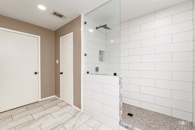 bathroom with tiled shower