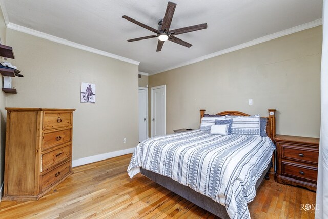 bedroom featuring ceiling fan, ornamental molding, and light hardwood / wood-style floors