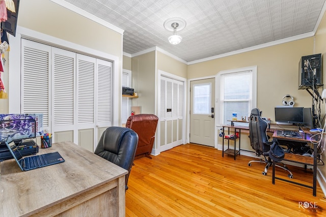 home office with ornamental molding and wood-type flooring