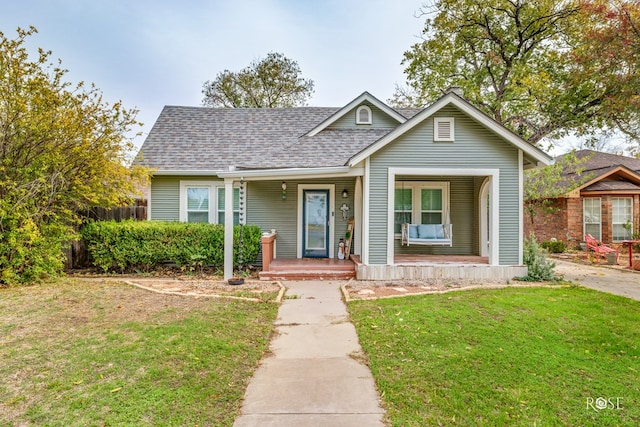 bungalow-style house featuring a front lawn