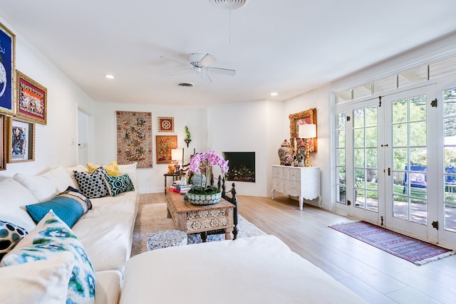 2121 Sul Ross St, San Angelo, TX 76904 - living room with wood finished floors, ceiling fan, recessed lighting, and french doors