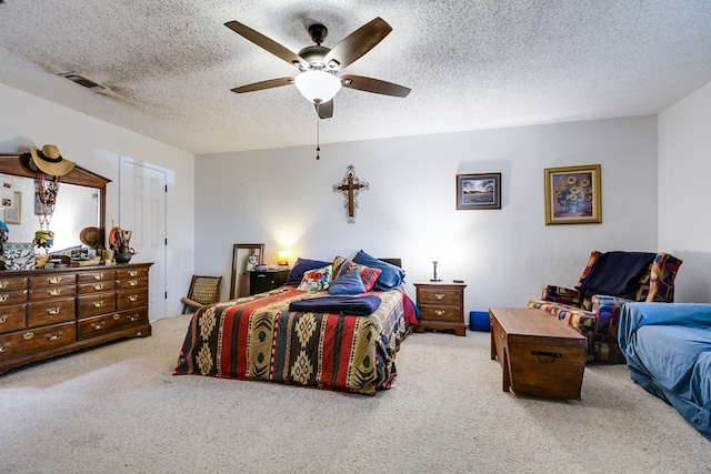 bedroom with a textured ceiling and ceiling fan