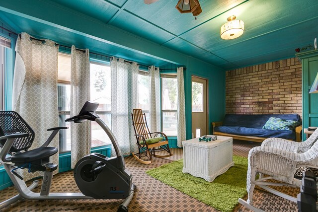 interior space featuring ceiling fan and carpet flooring