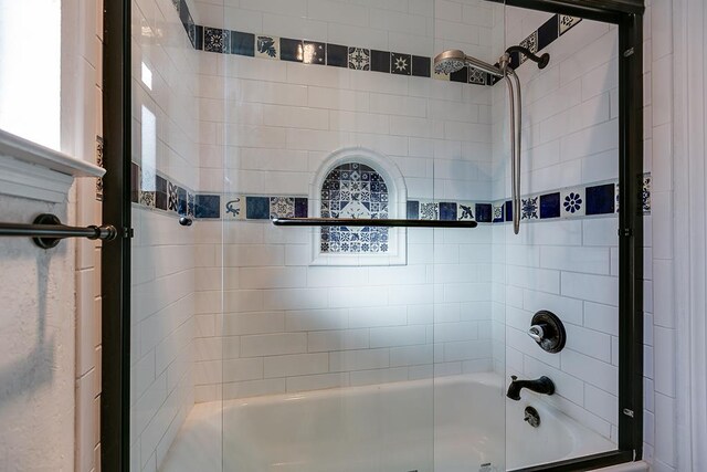 bathroom featuring enclosed tub / shower combo