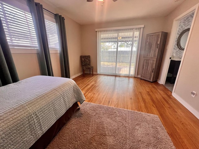 bedroom with ceiling fan, light hardwood / wood-style floors, and access to outside