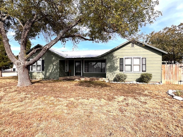 ranch-style home with a front yard