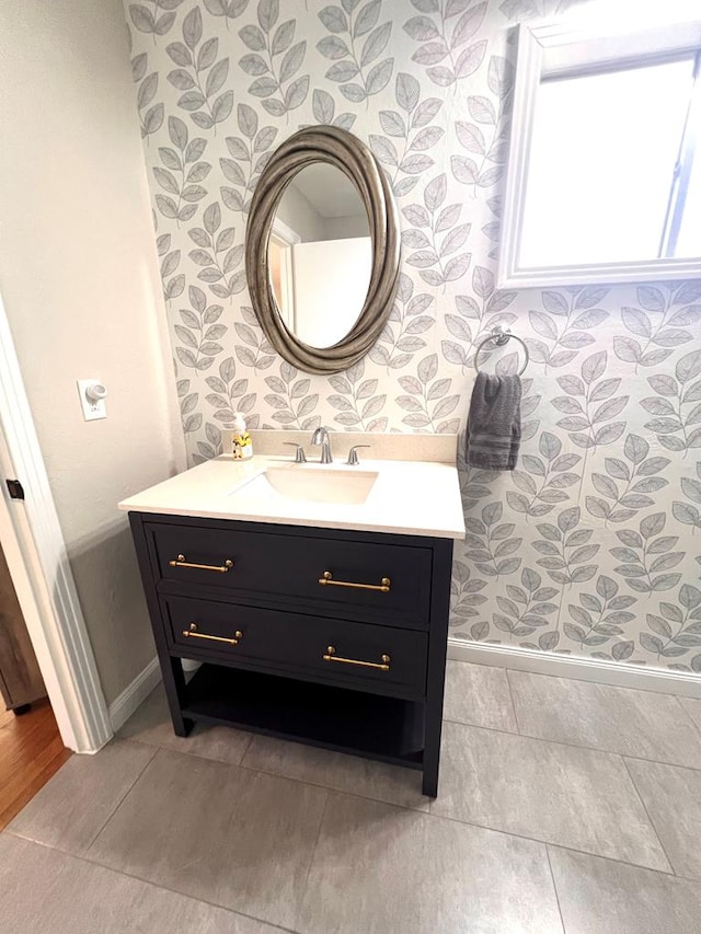 bathroom with tile patterned flooring and vanity