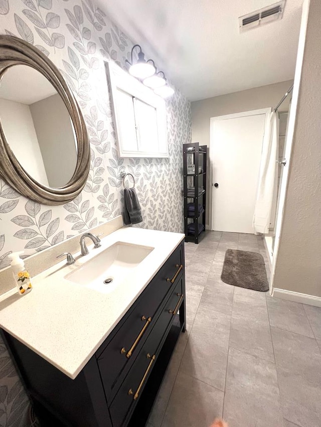 bathroom with vanity and walk in shower