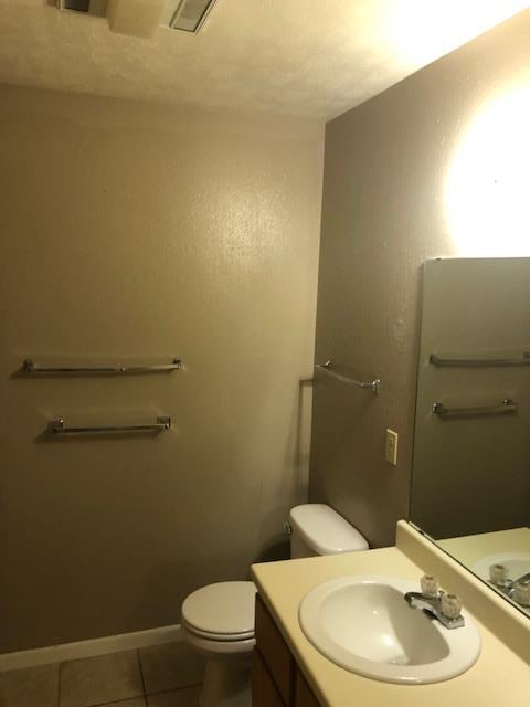 3603 Nevada Dr, San Angelo, TX 76904 - half bath featuring vanity and tile patterned floors