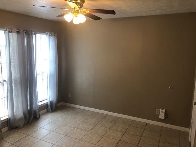 3603 Nevada Dr, San Angelo, TX 76904 - unfurnished room featuring a ceiling fan and light tile patterned flooring