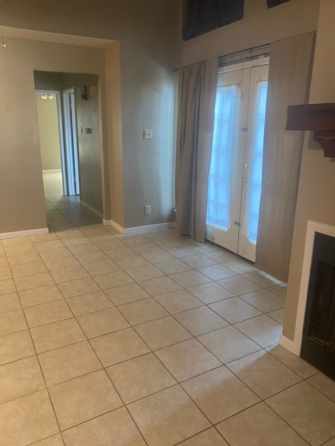 3603 Nevada Dr, San Angelo, TX 76904 - spare room featuring light tile patterned flooring and baseboards