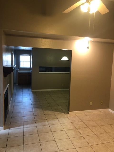 3603 Nevada Dr, San Angelo, TX 76904 - spare room with light tile patterned flooring and ceiling fan