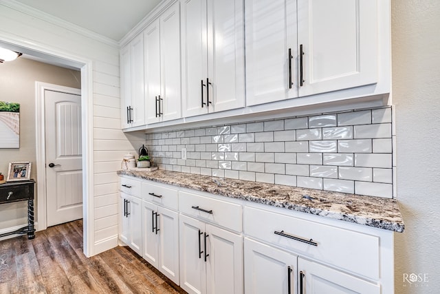 3513 Lindenwood Dr, San Angelo, TX 76904 - kitchen with backsplash, white cabinets, dark wood-style flooring, light stone counters, and crown molding