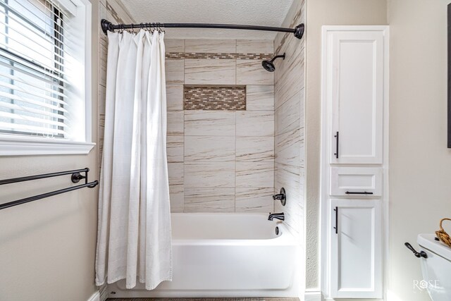 3513 Lindenwood Dr, San Angelo, TX 76904 - full bathroom featuring shower / bath combo with shower curtain and a textured ceiling