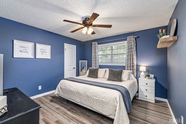 3513 Lindenwood Dr, San Angelo, TX 76904 - bedroom with a textured ceiling, wood finished floors, and a ceiling fan
