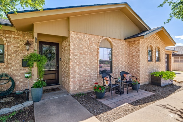 3513 Lindenwood Dr, San Angelo, TX 76904 - property entrance with brick siding and a garage