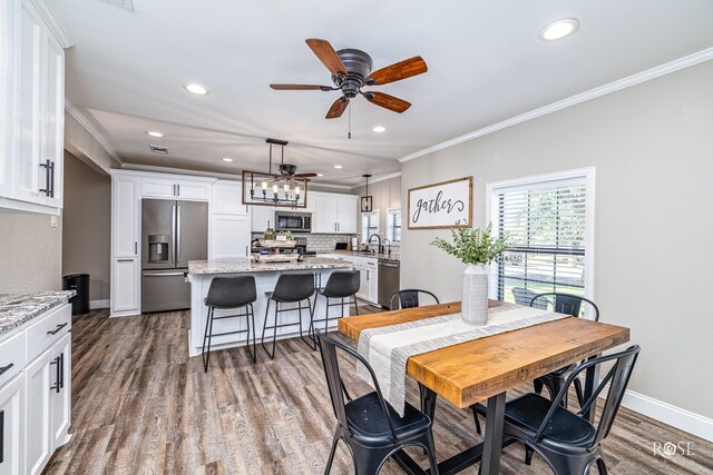 3513 Lindenwood Dr, San Angelo, TX 76904 - dining room with ornamental molding, dark wood finished floors, recessed lighting, and a ceiling fan