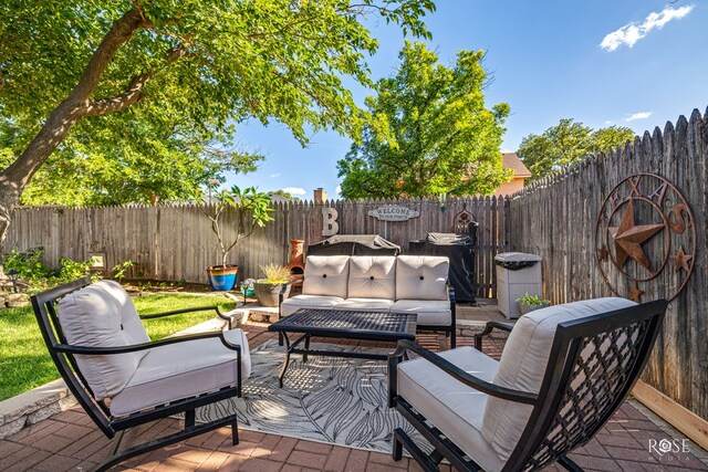 3513 Lindenwood Dr, San Angelo, TX 76904 - fenced backyard with an outdoor hangout area and a patio area