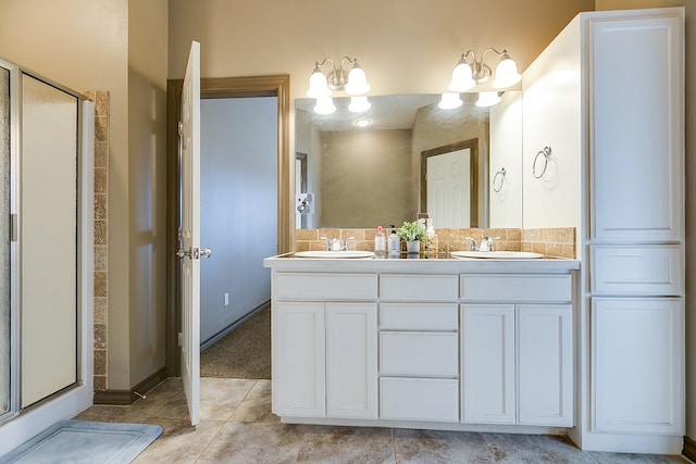 bathroom featuring a sink, double vanity, tile patterned flooring, and a shower stall