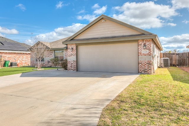 ranch-style house with brick siding, driveway, a front lawn, and central AC unit