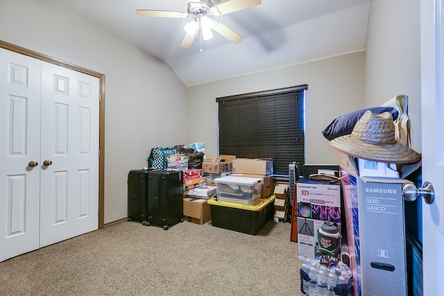 office featuring lofted ceiling, carpet flooring, and ceiling fan