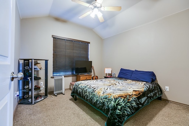 bedroom featuring ceiling fan, baseboards, vaulted ceiling, radiator, and carpet