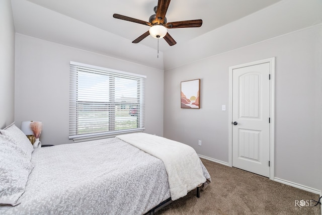 bedroom featuring baseboards, carpet floors, and a ceiling fan