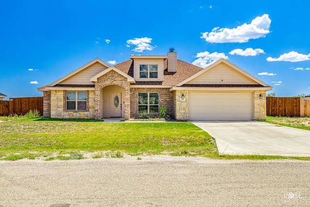 view of front of home with a front yard, fence, an attached garage, a chimney, and concrete driveway