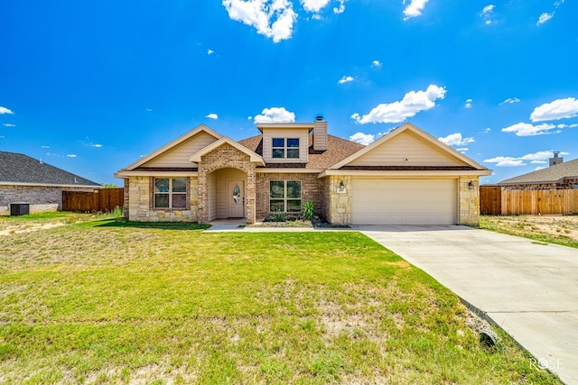 single story home featuring an attached garage, driveway, a front yard, and fence