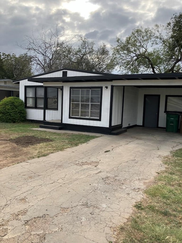 view of outbuilding with a carport