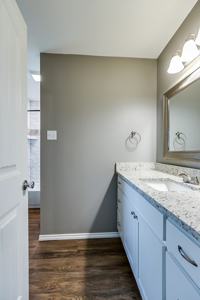 bathroom with vanity and hardwood / wood-style floors