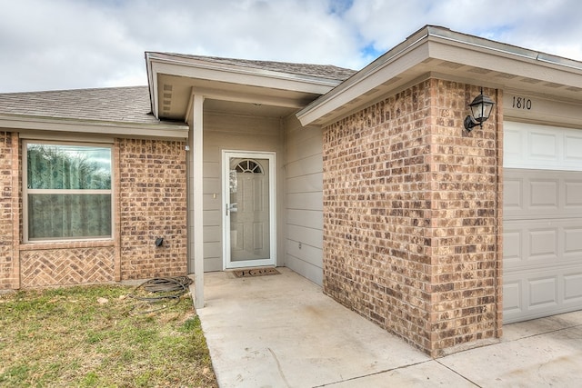 property entrance with a garage