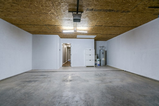 garage featuring a garage door opener and electric water heater