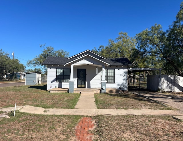 bungalow-style house with a front lawn