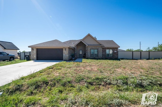 view of front of house with a garage and a front yard