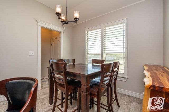 dining room featuring an inviting chandelier and light hardwood / wood-style floors