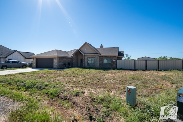 single story home with a garage