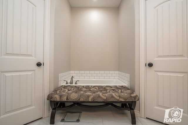 interior space with tile patterned flooring and a washtub