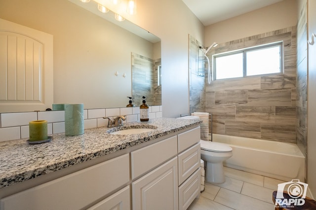 full bathroom featuring tile patterned flooring, backsplash, tiled shower / bath combo, vanity, and toilet