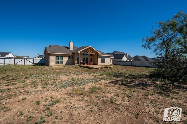 back of house featuring a deck