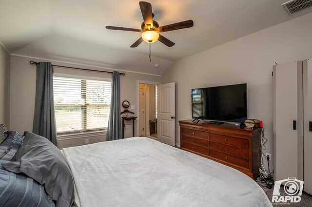 bedroom featuring ceiling fan and lofted ceiling